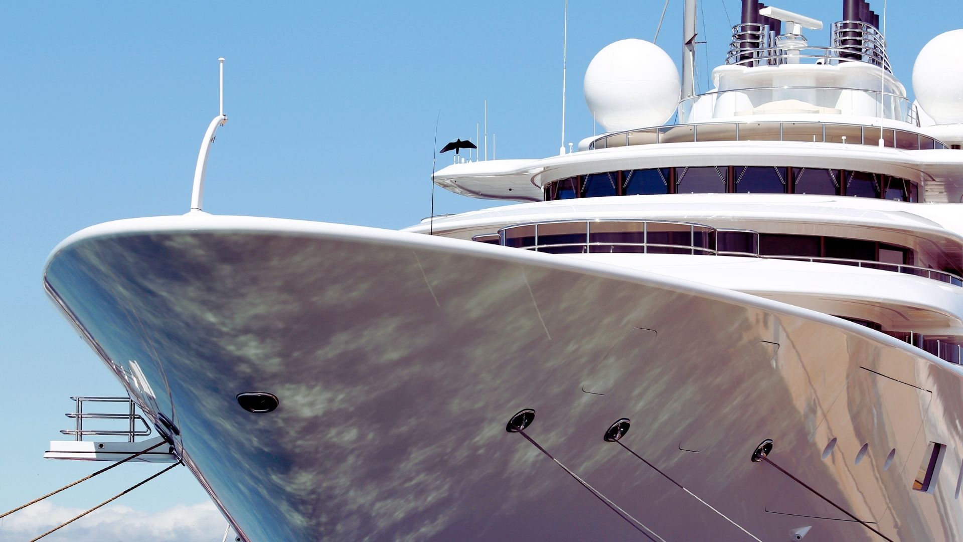 Azur dream Saint-Tropez The imposing bow of a moored superyacht in the sun