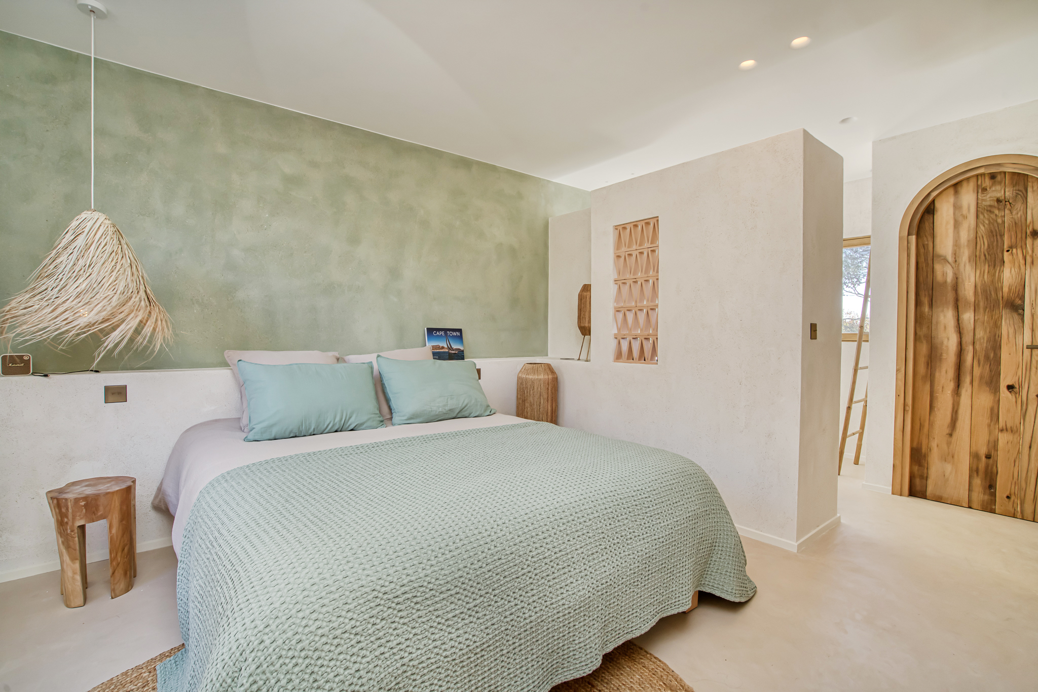 Bedroom in soft aqua tones at Villa Nu