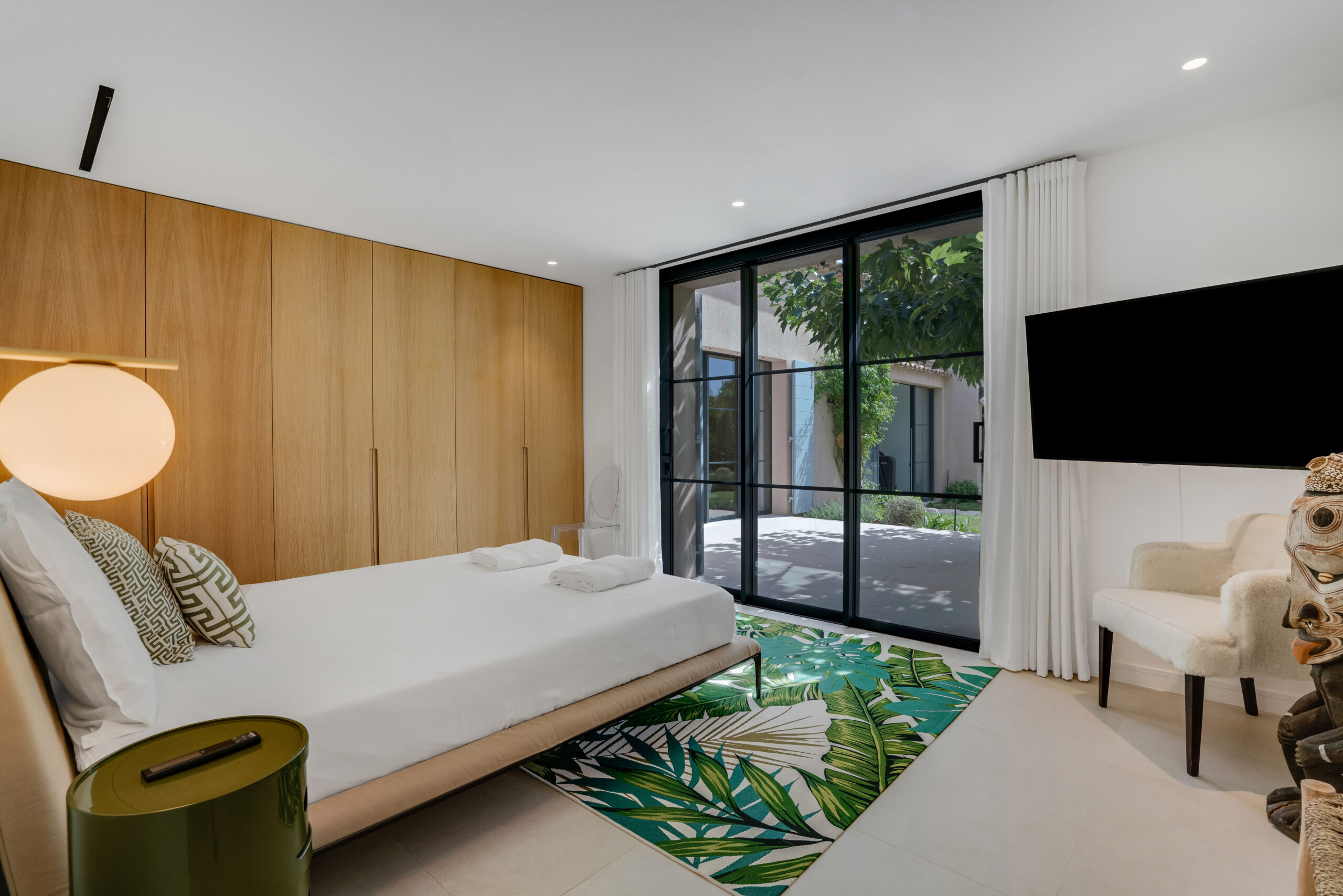 Bright designer bedroom at Villa Charlotte in Saint-Tropez