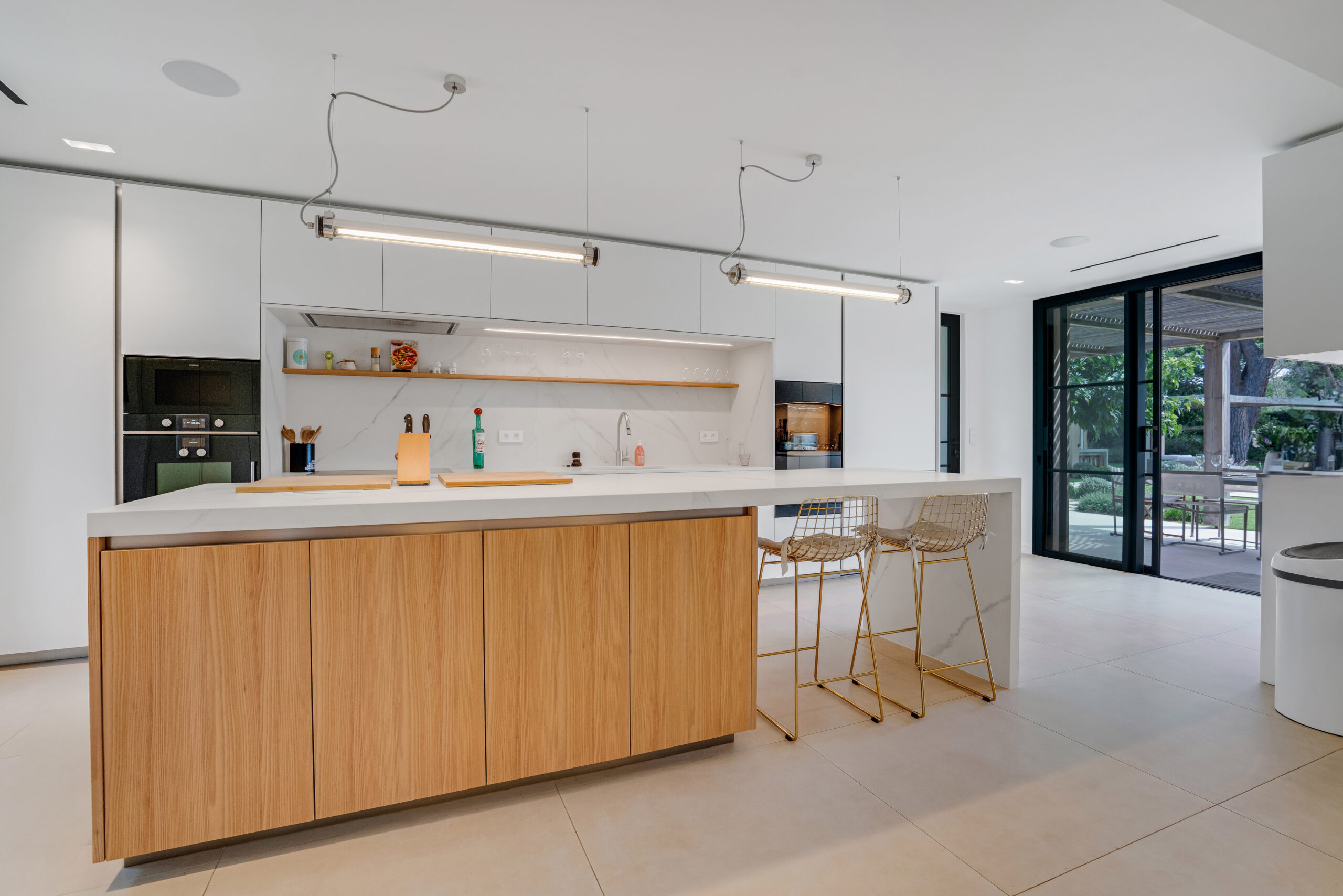Contemporary fitted kitchen with central island at Villa Charlotte