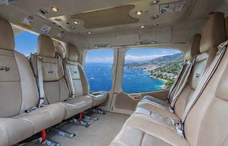 Bell 429 cabin, light leather seats facing the sea