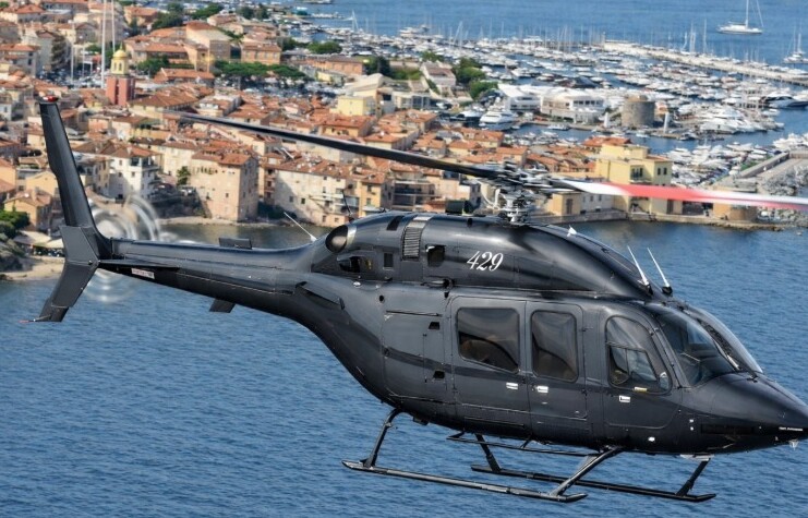 Bell 429 flying over the port of Saint-Tropez