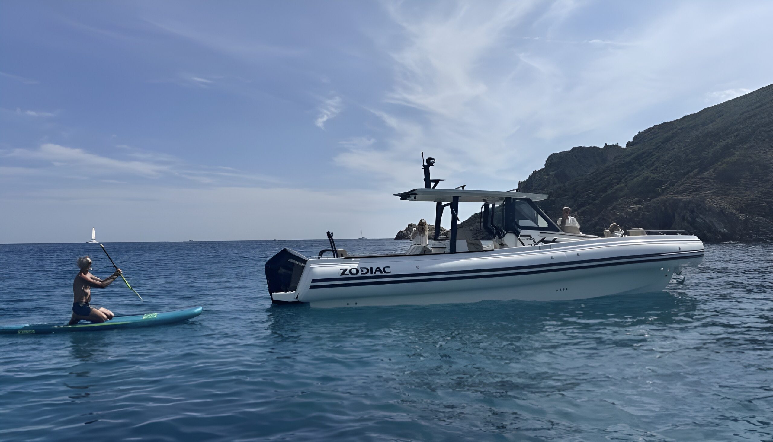 RIB at anchor and paddleboard in a bay near Saint-Tropez